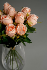 A bouquet of artificial peach roses. 