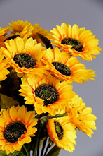 An arrangement of artificial sunflowers. 